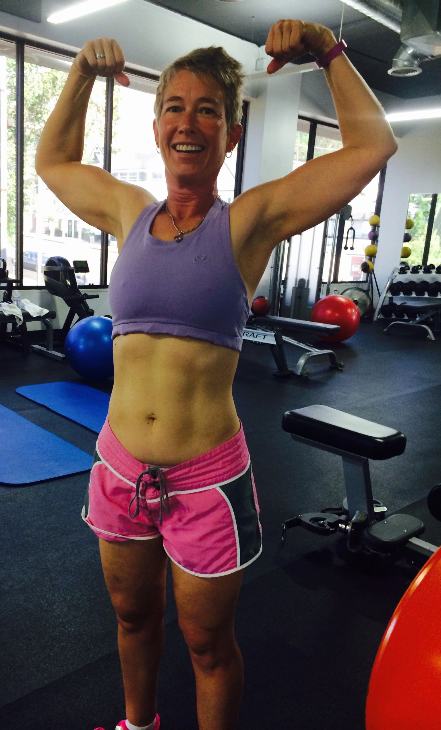 Woman gym flexing